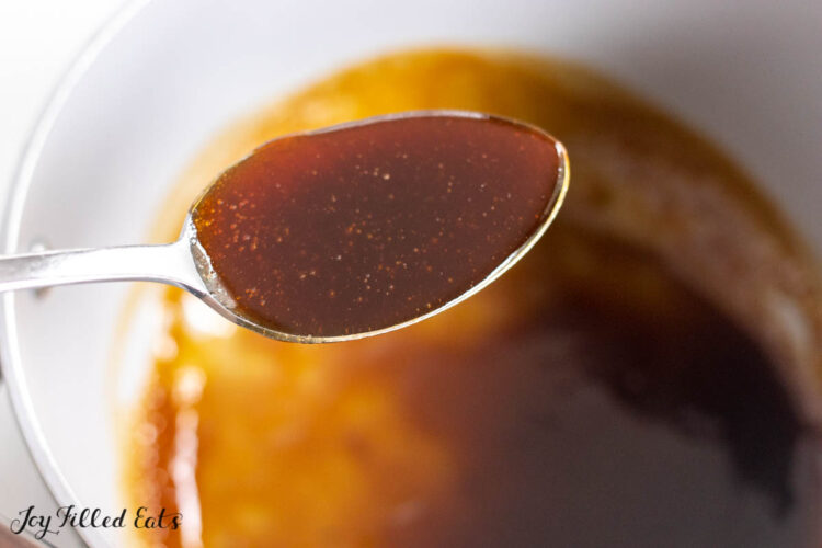spoon holding up thickened glaze